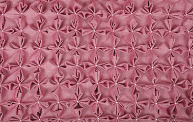 Close up background of pink textile puffs