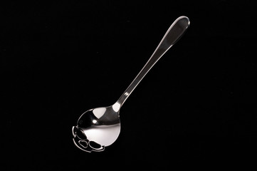 Metal spoon for sugar in the shape of skull death