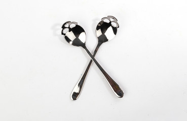 Metal spoons for sugar in the shape of skull