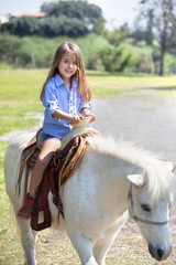 young girl on a horse