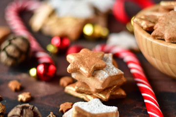 christmas cookies in the shape of stars decor gold, with candy,  tree and pine cones, and  balls yellow and red, Christmas 2019, new year is 2019, selective focus