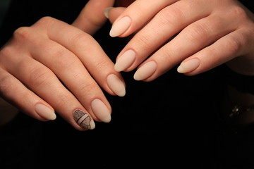 Beautiful nail design on female hands on background.