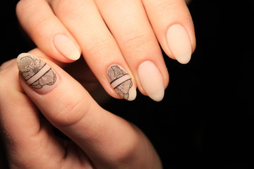 Beautiful nail design on female hands on background.