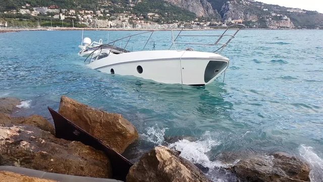 Close Up View Of Luxury Yacht Half Sunken After Storm In The Mediterranean Sea, France, Europe - 4K Resolution
