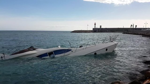 Close Up View Of Luxury Yacht Half Sunken After Storm In The Mediterranean Sea, France, Europe - 4K Resolution
