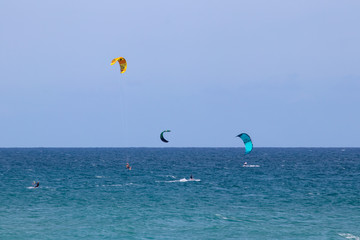 3 kite surfers in the ocean