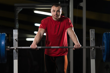 Fototapeta na wymiar Serious Powerlifter Standing in the Gym
