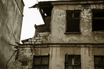 Ruins of an old abandoned city. Ruined house in which poor people live. Odessa, the ruins of a historic residential building. The ruins of an old earthquake-hit house. Lost city.