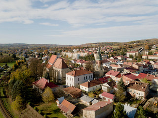Fototapeta premium Strzyzow, Poland - 9 9 2018: Photograph of the old part of a small town from a bird's flight. Aerial photography by drone or quadrocopter. Advertise tourist places in Europe. Planning a medieval town.