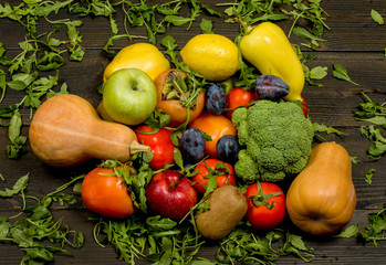 fresh fruits and vegetables on a dark wooden background