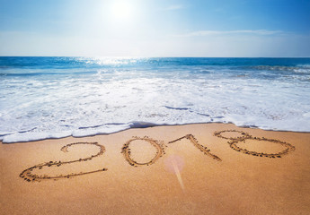 Old Year 2018 expires concept sandy tropical . ocean beach lettering concept image