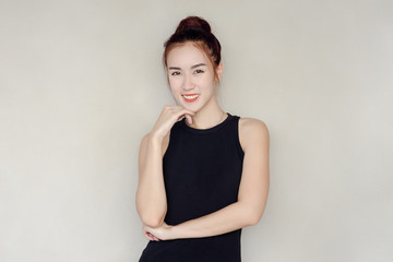 Obraz premium Beautiful woman in black dress smile