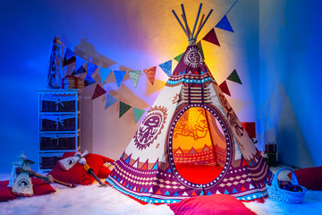 Children's room. Indians. Playroom for children. Needle. TIPI. © Grispb