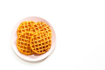 Homemade Pumpkin cornmeal waffles isolated on white top view