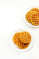 Homemade Pumpkin cornmeal waffles isolated on white top view