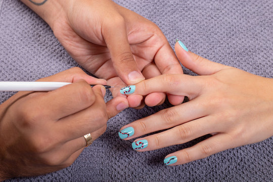 Manicure in beauty salon. Master make  nail design. Manicuring hands.
