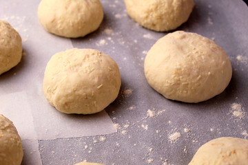 Fototapeta na wymiar homemade buns close-up with their own hands.