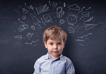 Smart little kid in front of a drawn up blackboard ruminate