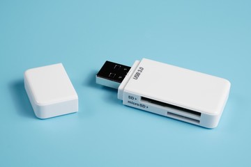 A USB 3.0 SD and microSD card reader isolated blue background