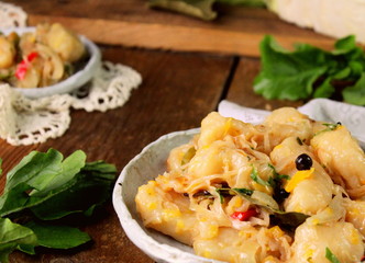 A dish of dough and cabbage, traditional cuisine, lazy dumplings with cabbage, selective focus.