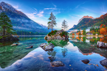 Fantastic autumn sunrise of Hintersee lake. Classic postcard view of Hintersee