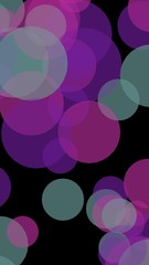 Multicolored translucent circles on a dark background. Vertical image orientation. 3D illustration