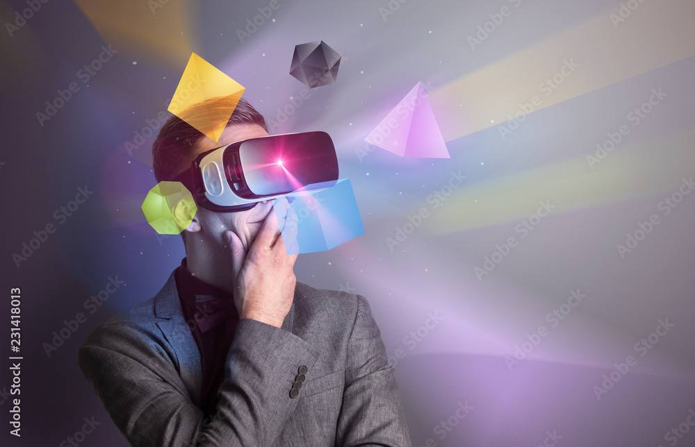 Poster amazed businessman with virtual reality colorful geometric shapes in front of him