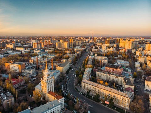 Aerial panoramic view of midtown of Voronezh city at sunset, Russia. Famous buildings and urban architecture with roads and car traffic