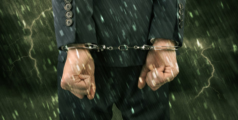 Stormy bad day concept with close handcuffed elegant man
