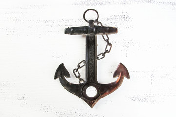 Vintage brass anchor wooden background © voisine574