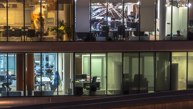 creative office workers during operation and at the end of working day, time lapse