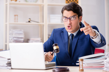 Fototapeta premium Young handsome judge working in court