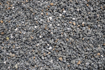 Grey gravel closeup photo for background. Sharp gray stones for construction. Gravel texture.