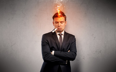Fever businessman with burning head concept
