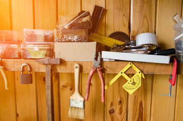 Variety handy tools on wood background