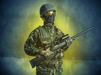 Hazard, menace soldier in a ruined crumbly building with arms on his hand
