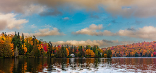 Fall colors in cottage country in the Laurentians, Quebec, Canada. - obrazy, fototapety, plakaty