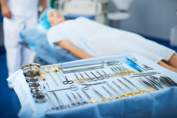 Close up of the medical instruments placed near the patient before the operation
