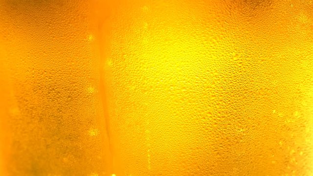 UHD macro of the glass of beer as a background