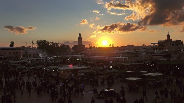 Famous Jemaa el Fna square crowded at sunset, Marrakesh, Morocco, 4k