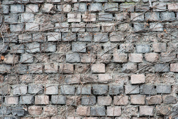 old brick wall of gray and pink