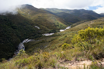 Fototapeta na wymiar Waterfall in the green valley
