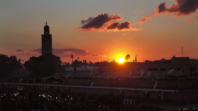 Famous Jemaa el Fna square crowded at sunset, Marrakesh, Morocco, 4k