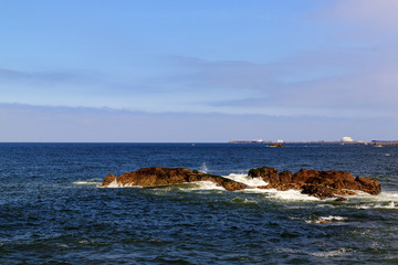 Rocks in the Atlantic ocean, Porto, Portugal. Beautiful coast on a Sunny day.