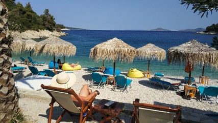 Lounging on the beach, Greece, islands - obrazy, fototapety, plakaty
