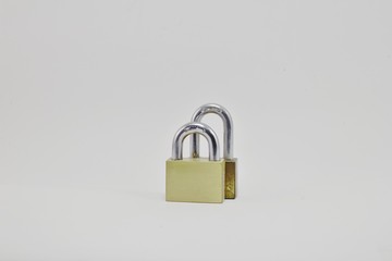 Naklejka premium Two golden padlock on white background.