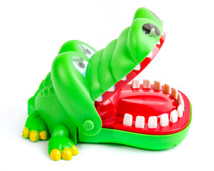 Alligator, green plastic crocodile toy on isolated