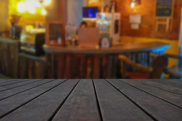 empty wooden table on on coffee shop background, with copy space