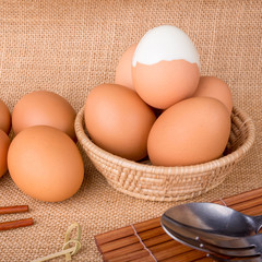 Set Eggs in a basket on  gunny (sackcloth)  background