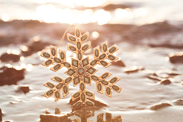 Christmas Snowflake At Golden Sunset